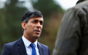 Britain's Prime Minister Rishi Sunak speaks as he takes part in broadcasting a clip during his visit to the Helles Barracks at the Catterick Garrison, a military base in North Yorkshire, on May 3, 2024. Britain's Labour opposition urged Prime Minister Rishi Sunak to call a general election, on May 3, after seizing another parliamentary seat from the Conservatives and making significant gains in English local elections. (Photo by Molly Darlington / POOL / AFP)