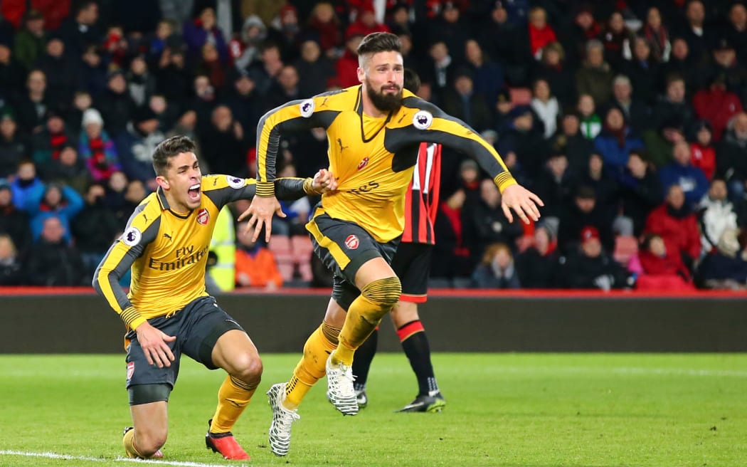 Olivier Giroud (R) and Gabriel Paulista of Arsenal celebrate a goal.