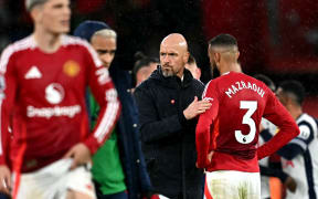 Manchester United's Dutch manager Erik ten Hag reacts after another loss, 2024.