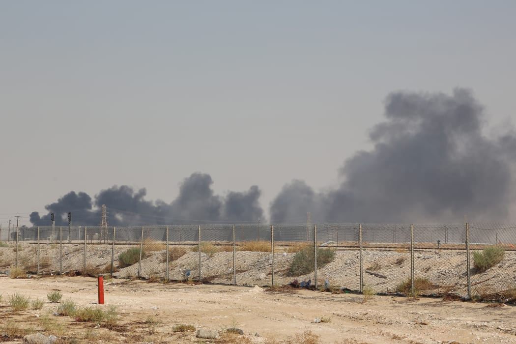 Smoke billows from an Aramco oil facility in Abqaiq about 60km southwest of Dhahran in Saudi Arabia's eastern province on 14 September.