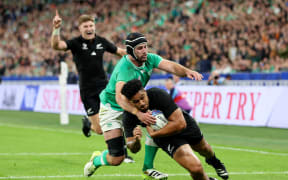 Leicester Fainga'anuku scores his team's first try during the Rugby World Cup France 2023 quarter-final match between Ireland and New Zealand at Stade de France on 14 October, 2023 in Paris, France.