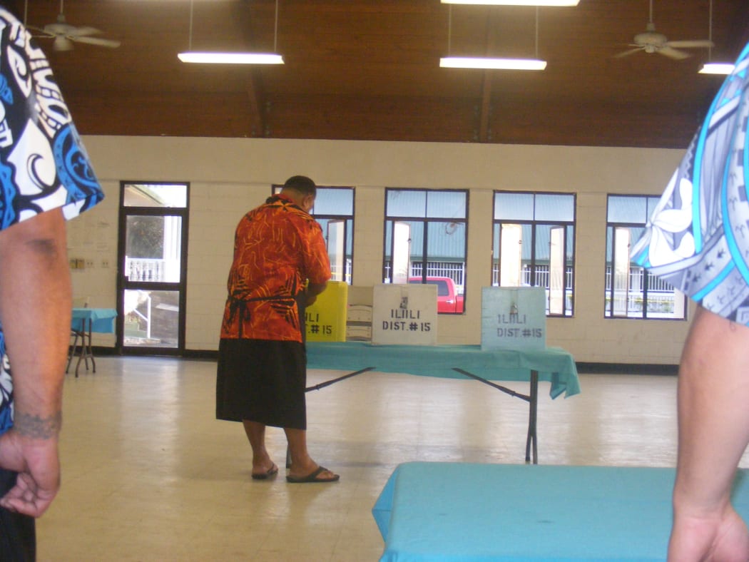 An election office team leader at the Ili’ili polling station opens ballot boxes for the 2016 general election in American Samoa.