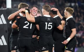 Brodie McAlister celebrates his try against France.