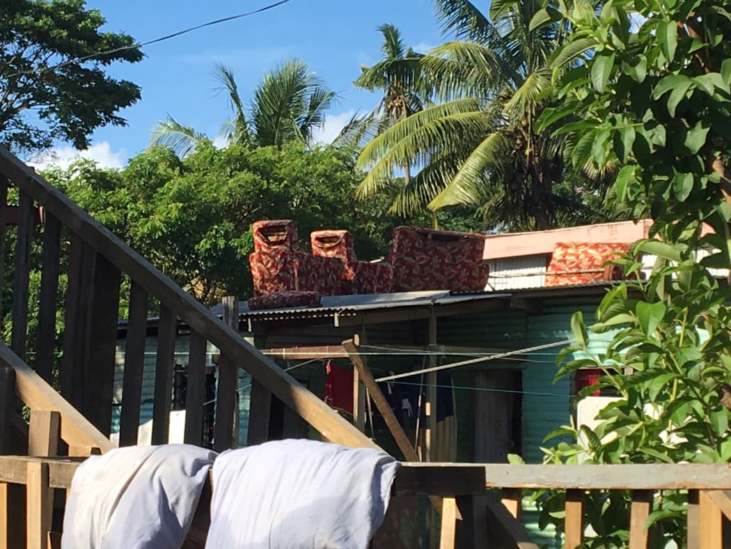 Furniture set out to dry on a roof in Nawaka