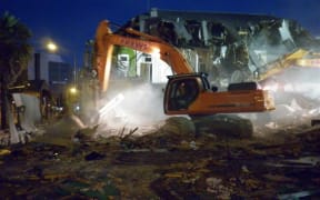 A digger demolishes part of the Carlton Hotel (Tim Graham)