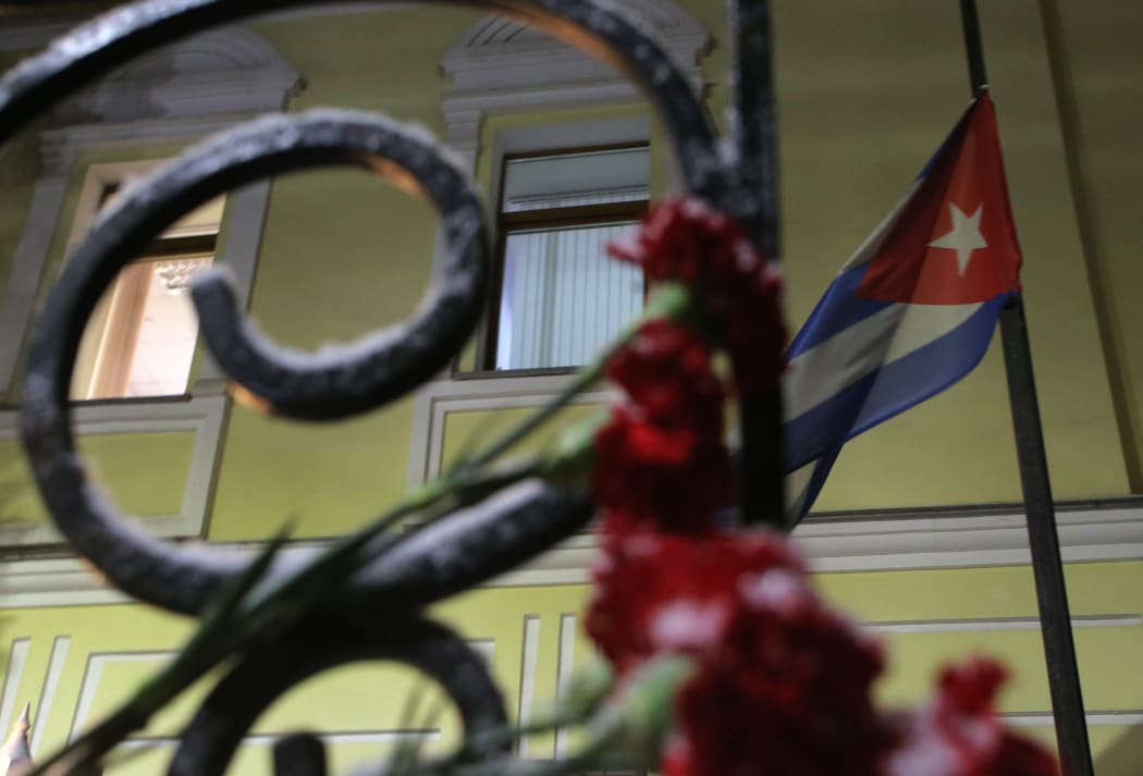 A flag flies low outside the Cuban Embassy in Moscow, Russia, after Fidel Castro's death.