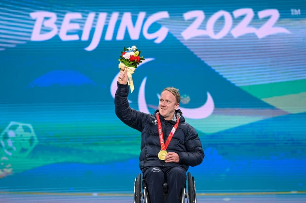 Gold medalist Corey Peters of New Zealand poses during the awarding ceremony for the para alpine skiing Men's Downhill Sitting of Beijing 2022 Paralympic Winter Games at Yanqing Medals Plaza of the Winter Paralympics in Yanqing District, Beijing, March 5, 2022.