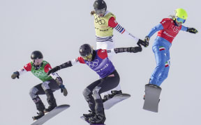 (220209) -- ZHANGJIAKOU, Feb. 9, 2022 (Xinhua) -- Stacy Gaskill and Lindsey Jacobellis of the United States, Chloe Trespeuch of France, Michela Moioli of Italy (L to R) compete during the women's snowboard cross semifinal of the Beijing 2022 Winter Olympics at Genting Snow Park in Zhangjiakou,