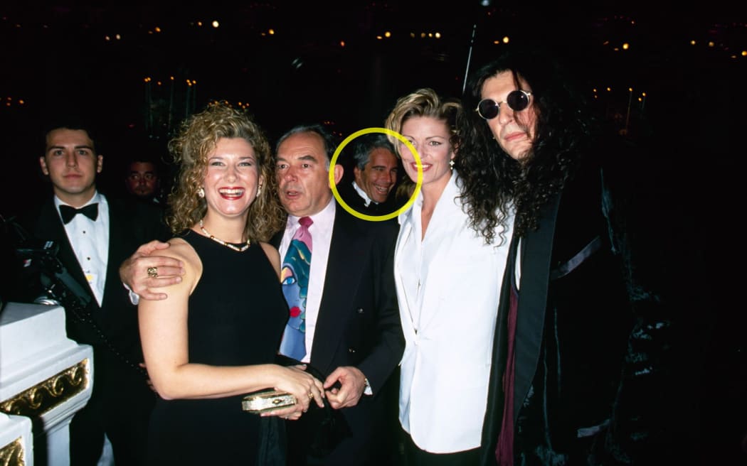 Alison Stern, Robin Leach, Jeffrey Epstein, Cecilia Nord and Howard Stern are seen at Donald Trump’s wedding to Marla Maples in New York in December 1993. Note: CNN has highlighted a portion of this photo to more clearly identify Epstein in the picture.