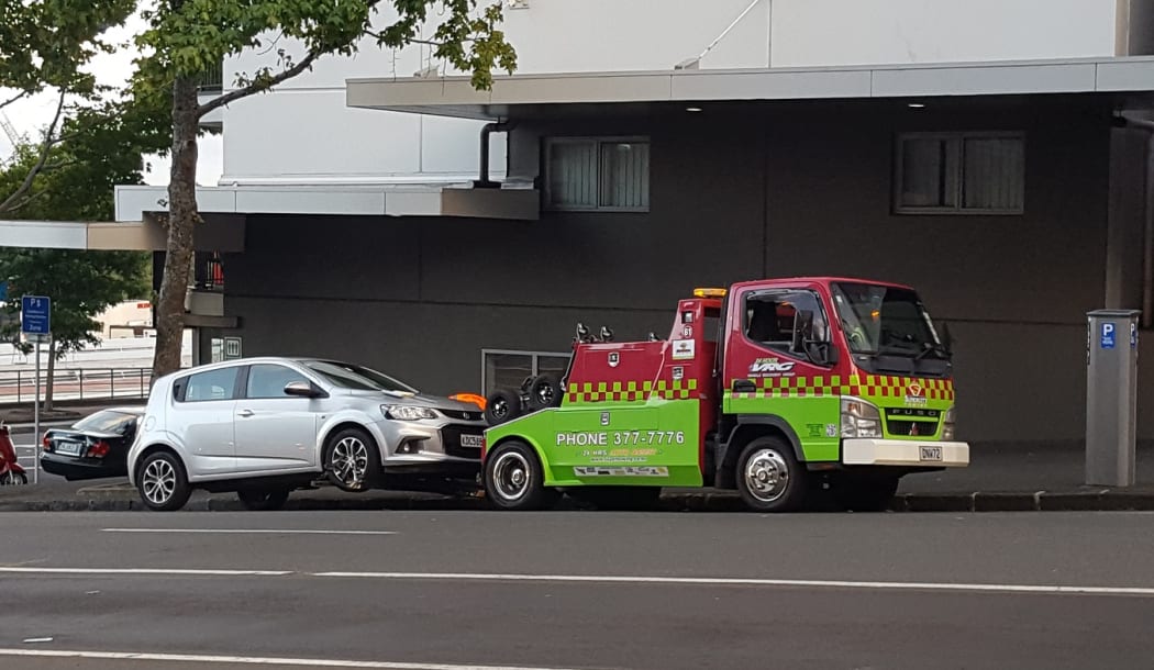 The tow truck only moved when it towed this car from the other side of the street