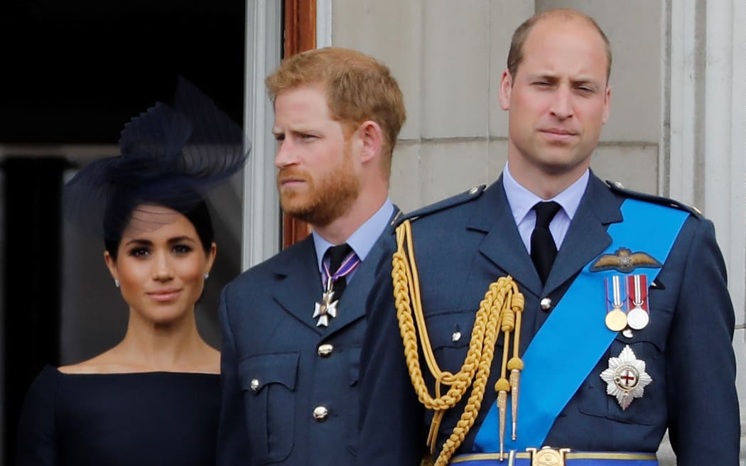 Meghan, Duchess of Sussex, Prince Harry, Duke of Sussex and Prince William, Duke of Cambridge stand on the balcony of Buckingham Palace in July to watch a military fly-past to mark the centenary of the RAF.