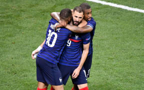Karim Benzema of France is hugged.