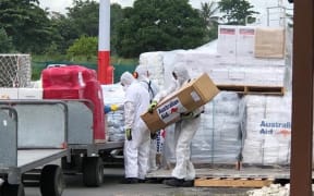 Cyclone aid from Australia's third delivery is unloaded.