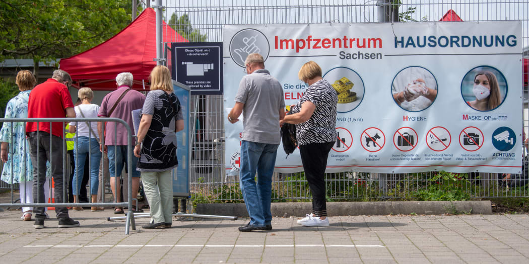 People queue for vaccinations at a centre in Leipzig in June 2021.