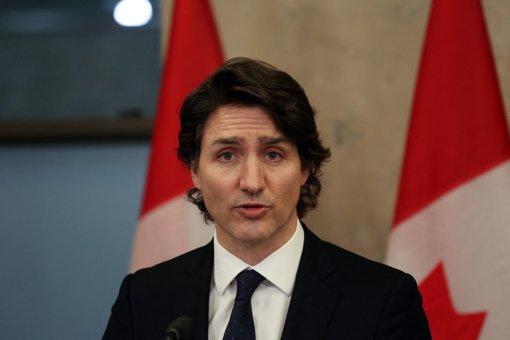 Canada's Prime Minister Justin Trudeau speaks with reporters during a news conference on Parliament Hill February 11, 2022 in Ottawa, Canada.