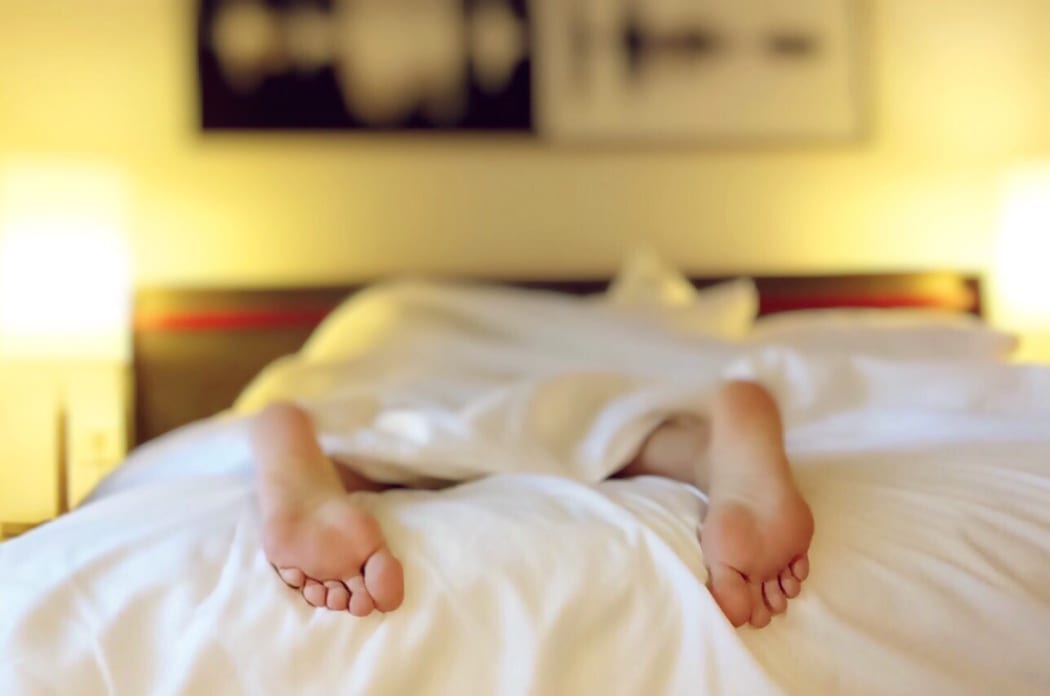 women's feet in bed