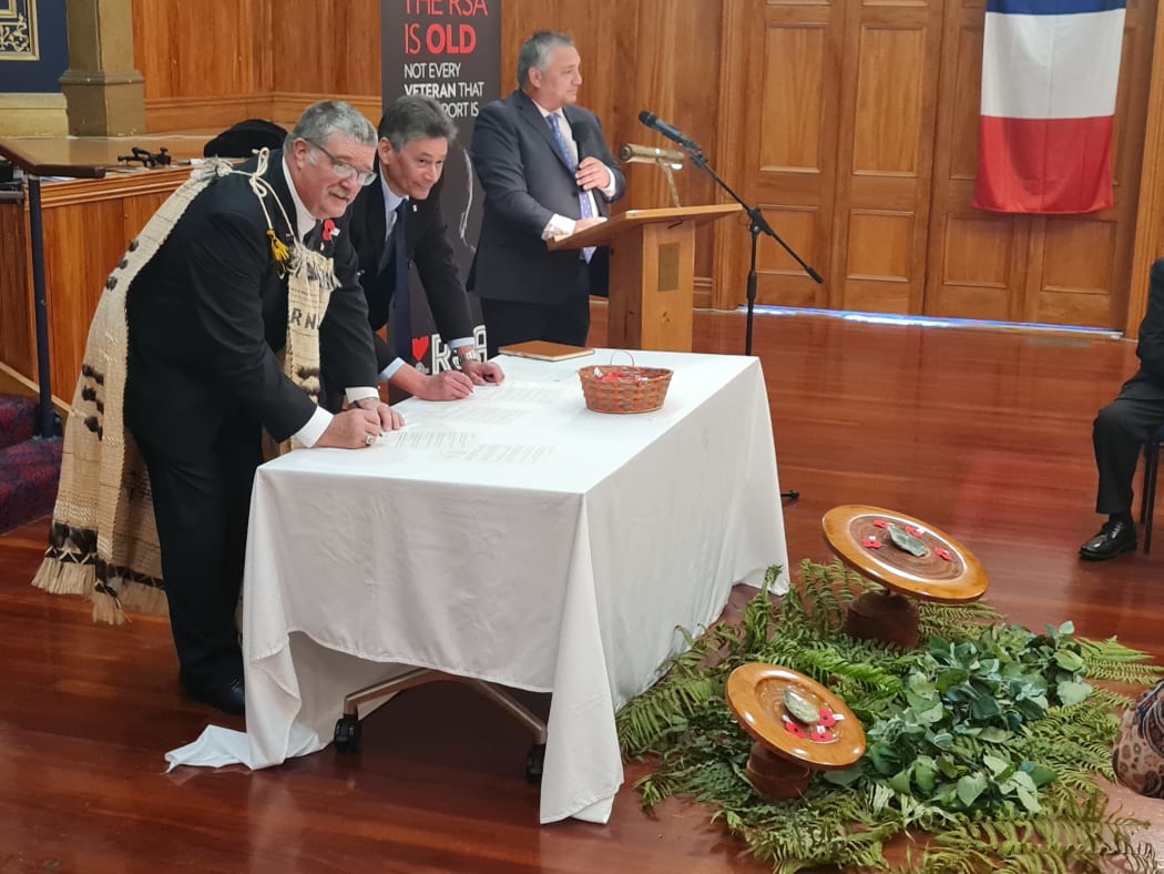 BJ Clark and Graham Yarrall sign a memorandum of understanding between the RSA and its French equivalent, Union Nationale des Combattants.