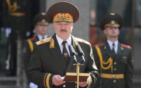 In this handout photo released by BelTA, Belarusian President Alexander Lukashenko attends the oath-taking ceremony by representatives of various military service branches of Belarus following his inauguration in Minsk, Belarus.