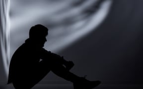 Abandoned man in dark room.