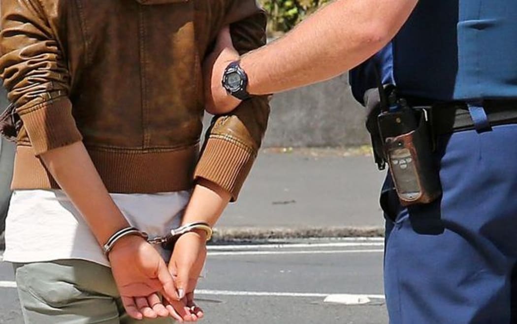 generic arrest person in handcuffs