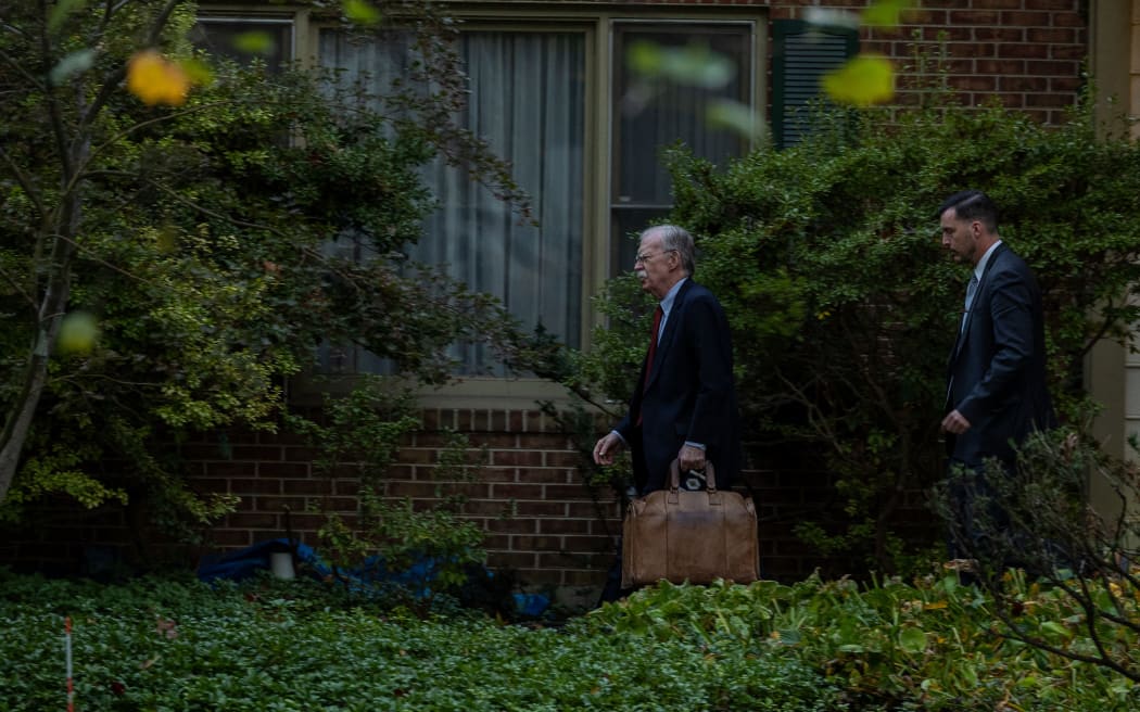 John Bolton leaves his home on 17 October, 2025 in Bethesda, Maryland.