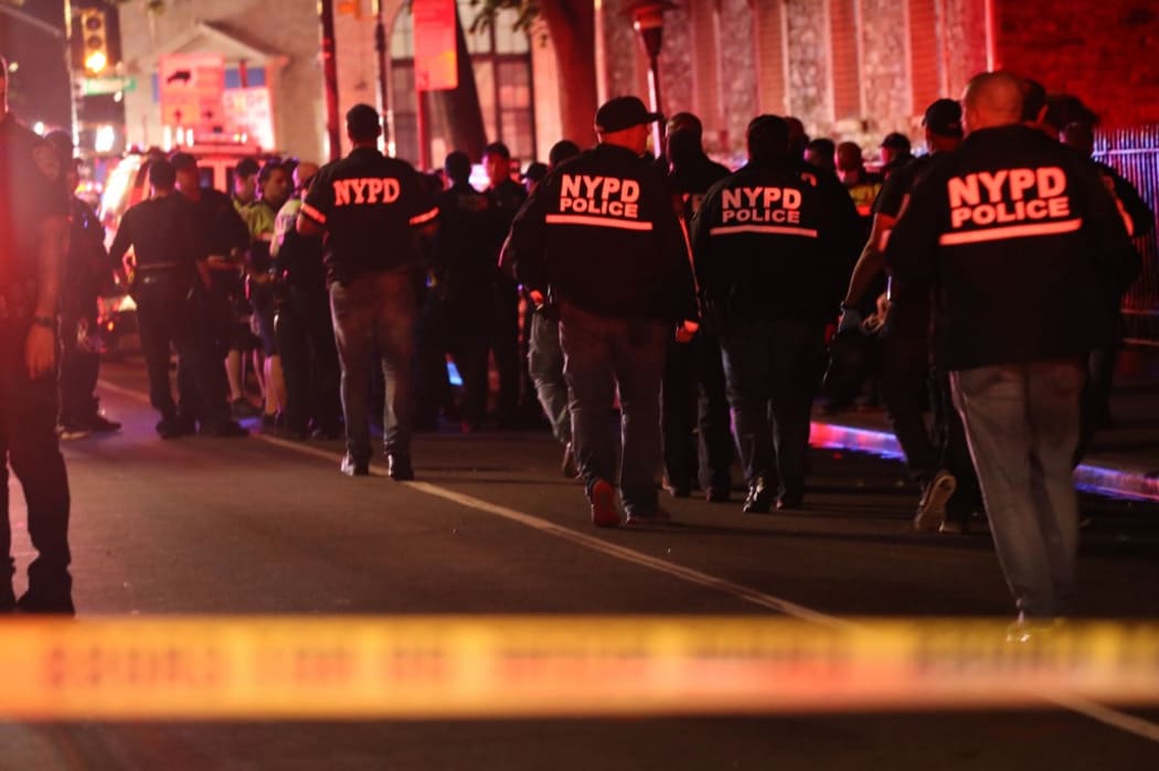 NEW YORK, NEW YORK - JUNE 03: Police gather at the scene where two New York City police officers were shot in a confrontation late Wednesday evening in Brooklyn on June 03, 2020 in New York City.