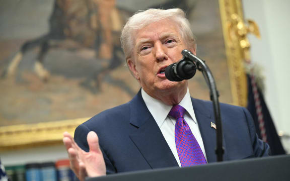 US President Donald Trump makes an announcement in the Roosevelt Room of the White House in Washington, DC on February 12, 2026. President Donald Trump on Thursday revoked a landmark scientific finding that underpins US regulations aimed at curbing planet-warming pollution, marking the administration's most far-reaching rollback of climate policy to date. (Photo by SAUL LOEB / AFP)