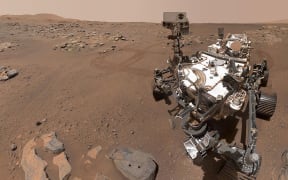 In this image released by NASA, Perseverance Mars rover, using its WATSON camera, took this selfie over a rock nicknamed "Rochette" where two holes can be seen where the rover used its robotic arm to drill rock core samples on September 10, 2021. - The Perseverance rover on Mars collected two probable samples volcanic rock, NASA announced on September 10, 2021, stressing that the presence of salt in these rocks was an indicator of favorable conditions to possibly detect traces of ancient life. (Photo by Handout / various sources / AFP) / RESTRICTED TO EDITORIAL USE - MANDATORY CREDIT "AFP PHOTO / NASA/JPL-Caltech/MSSS" - NO MARKETING - NO ADVERTISING CAMPAIGNS - DISTRIBUTED AS A SERVICE TO CLIENTS