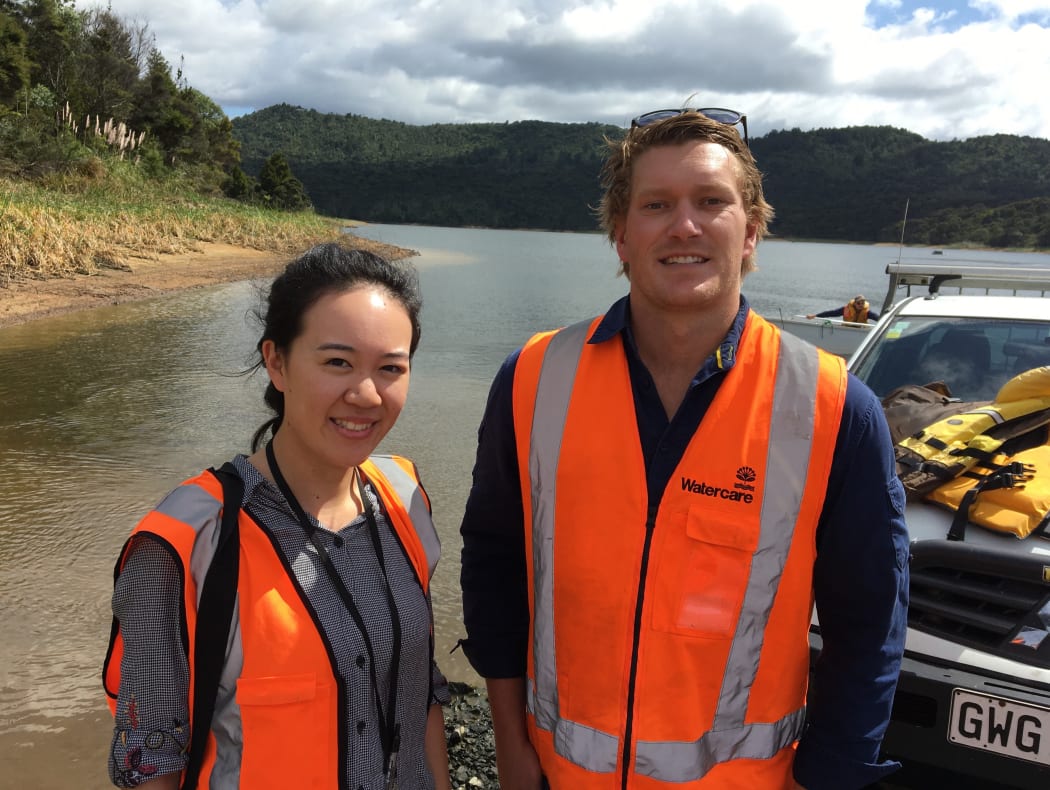 The Detail Reporter Jessie Chiang and Joseph Challoner-Warman, Watercare Environmental Assets manager, at the Lower Nihotupu dam