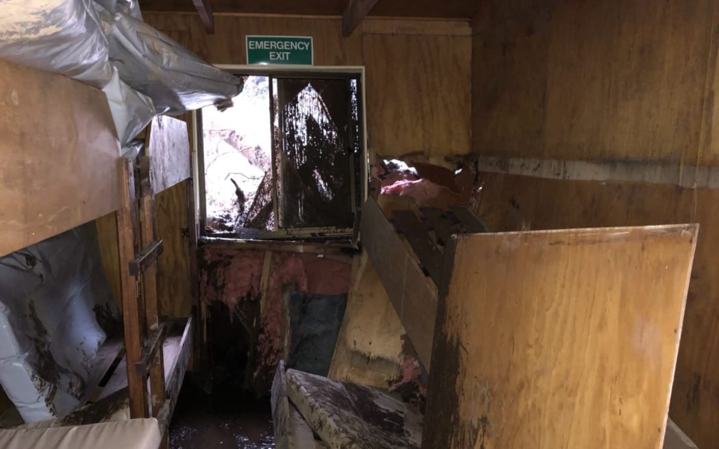 A land slip in torrential rain smashed through the Howden hut on the Routeburn track on Tuesday morning.
