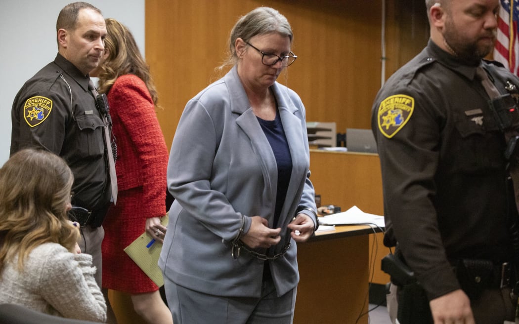 PONTIAC, MICHIGAN - JANUARY 31: Jennifer Crumbley, the mother of Oxford School shooter Ethan Crumbley, exits the courtroom of Oakland County Court during a break on the fifth day of her trial on four counts of involuntary manslaughter on January 31, 2024 in Pontiac, Michigan. This is the first time in U.S. history that the parents of a mass school shooter have been tried for their role in the murders committed by their child. James Crumbley, the father of Ethan Crumbley, will be tried in March.   Bill Pugliano/Getty Images/AFP (Photo by BILL PUGLIANO / GETTY IMAGES NORTH AMERICA / Getty Images via AFP)