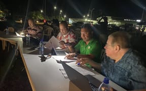 The parliament is leading a series of public hearings on the new Compact funding agreement with the United States. Shown here, at an outdoor public hearing March 21 in Majuro are, from left: Marshall Islands Attorney General Bernard Adiniwin, Ambassador to the United States Charles Paul, Foreign Minister Kalani Kaneko, and legal advisor Gregory Danz. Photo: Hilary Hosia.