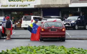 Police speaking to a Samoa supporter in Ōtara.