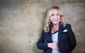 Singer Rickie Lee Jones, concrete wall background
