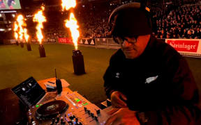 DJ Al’Goodie behind decks at an All Blacks game in July 2024.