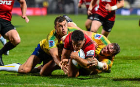 Codie Taylor of the Crusaders scores a try against the Bulls