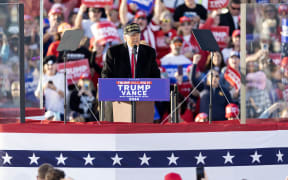 Former US President Republican presidential candidate Donald Trump speaks during a campaign rally in Kinston, North Carolina, on November 3, 2024.