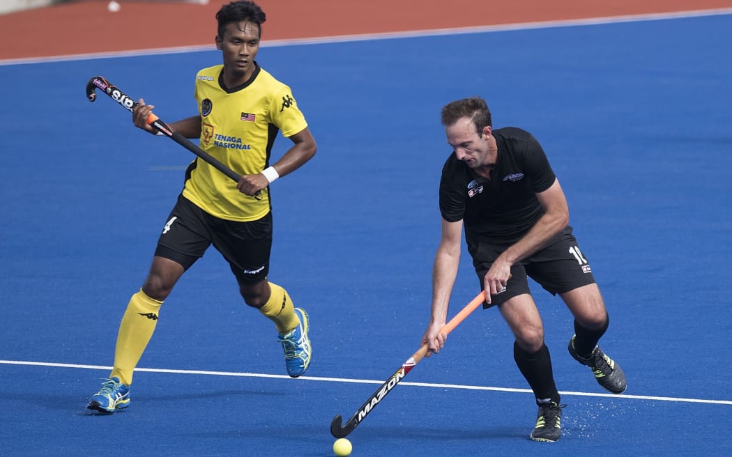 Ryan Archibald with Ramadan Rosli of Malaysia.