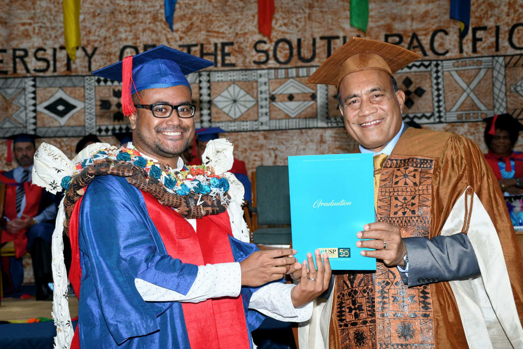 PhD in Climate Change graduate, Jale Samuwai, is conferred with the award by the H.E Taneti Maamau, Chancellor of USP