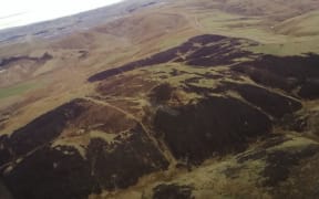 An aerial shows the Macraes fire, which covered 800 hectares of farmland.