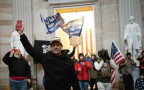 WASHINGTON, DC - JANUARY 06: A pro-Trump mob enters the Rotunda of the U.S. Capitol Building on January 06, 2021 in Washington, DC. Congress held a joint session today to ratify President-elect Joe Biden's 306-232 Electoral College win over President Donald Trump. A group of Republican senators said they would reject the Electoral College votes of several states unless Congress appointed a commission to audit the election results.   Win McNamee/Getty Images/AFP (Photo by WIN MCNAMEE / GETTY IMAGES NORTH AMERICA / Getty Images via AFP)