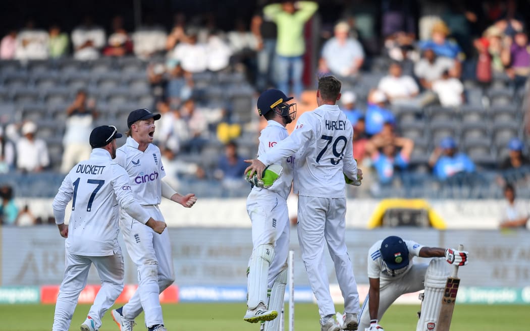 England's Tom Hartley celebrates with teammates.