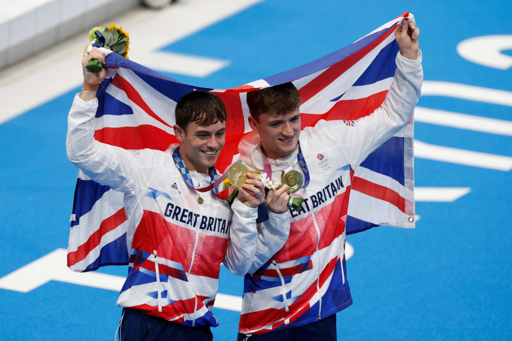 Britain's Thomas Daley, left, and  Matty Lee pose with their medals after winning the men's synchronised 10m platform diving final event during the Tokyo 2020 Olympic Games at the Tokyo Aquatics Centre in Tokyo on 26 July, 2021.
