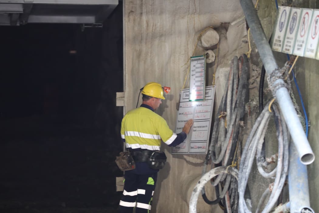 A crewman looks at list outside the 30m concrete seal at Pike River mine.