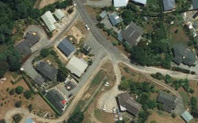 An aerial shot of properties in Havelock shows the differences in grass colours.