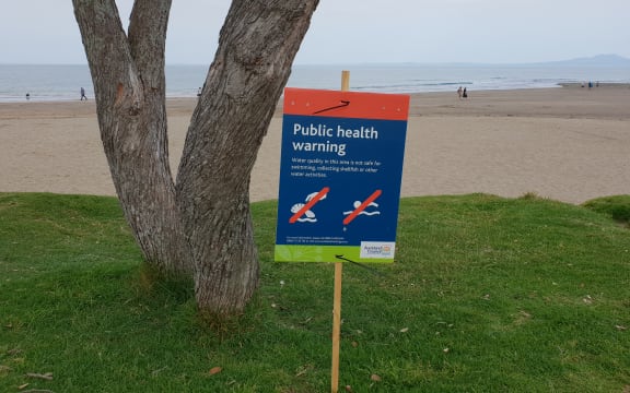 A swimming warning sign at Brown's Bay beach in Auckland.