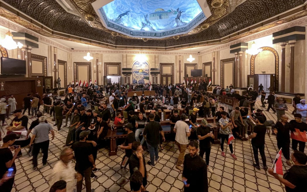 Supporters of Iraqi cleric Muqtada al-Sadr storm the Presidential Palace at Green Zone after Muqtada al-Sadr announces his total withdrawal from politics in Baqhdad, Iraq on August 29, 2022.