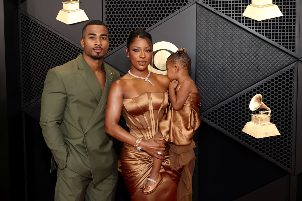 LOS ANGELES, CALIFORNIA - FEBRUARY 04: (L-R) John Gaines, Victoria Monét and Hazel Monét attend the 66th GRAMMY Awards at Crypto.com Arena on February 04, 2024 in Los Angeles, California.   Matt Winkelmeyer/Getty Images for The Recording Academy/AFP (Photo by Matt Winkelmeyer / GETTY IMAGES NORTH AMERICA / Getty Images via AFP)