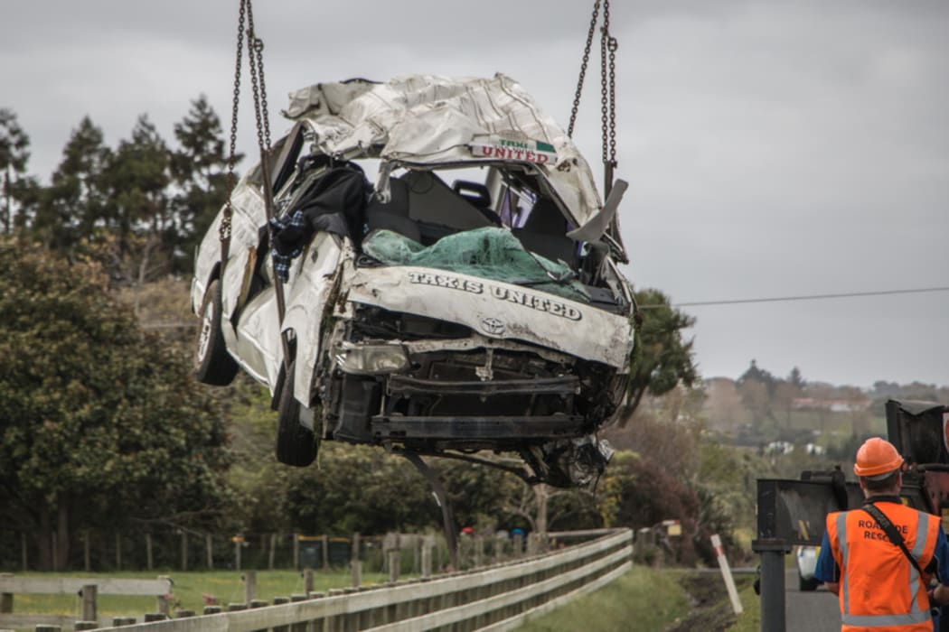 A taxi van with several passengers including children on board has rolled into a paddock on Waiuku Road, near Waiuku, south of Auckland.