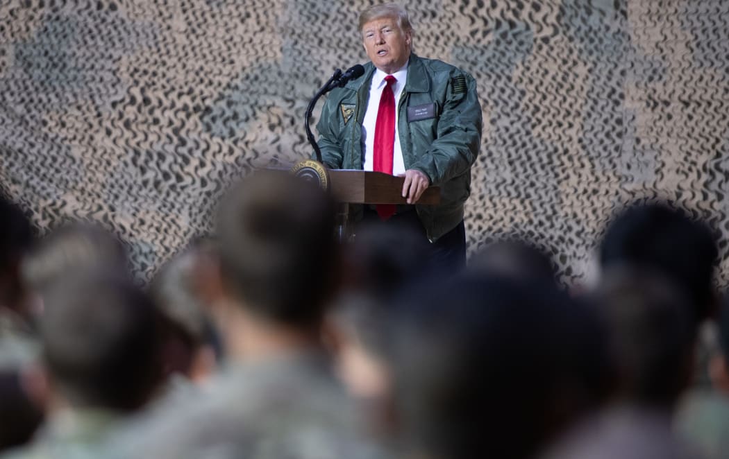 US President Donald Trump speaks to members of the US military during an unannounced trip to Al Asad Air Base in Iraq, December 26, 2018.